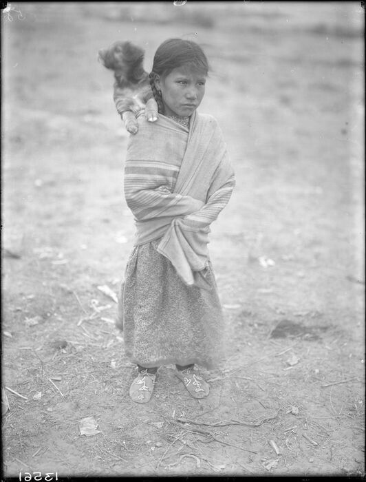 A little Lakoata girl and her dog traveled with Sitting Bull to Crow Country in 1886. / Fred Miller Collection, Smithsonian Institute