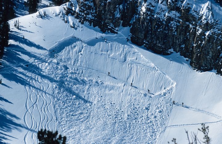 Five backcountry skiers cross an avalanche path while hiking outside of Jackson Hole Resort, Wyoming, 2013 / Istock photos