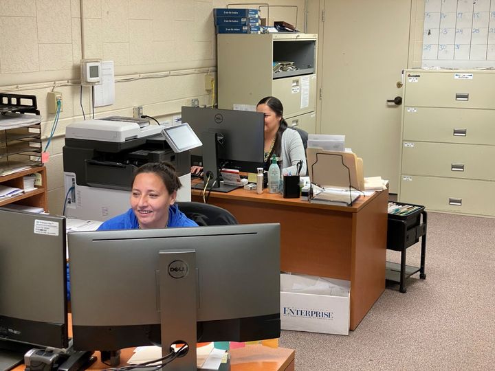 Misty McCormick and Erica Turns Plenty  on Tuesday work to register students. New student programs at the college are pairing